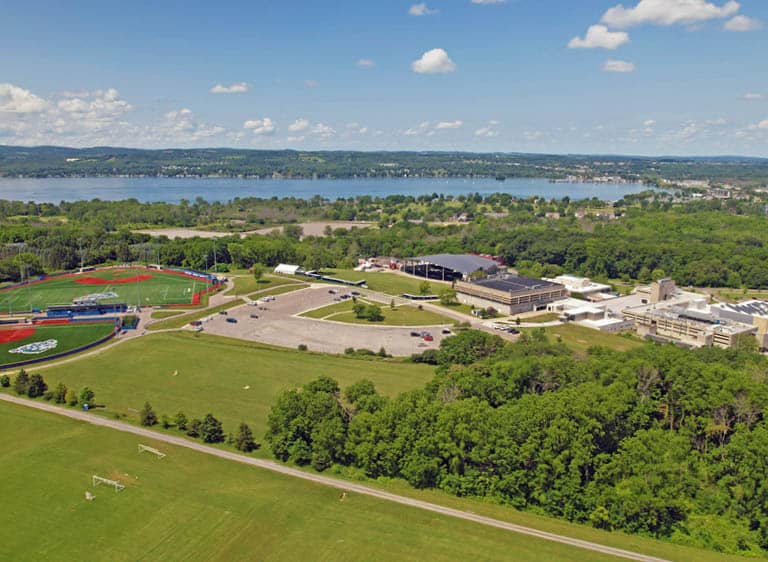 FLCC main campus and athletic facilities seen from above with Canandaigua Lake in the background.