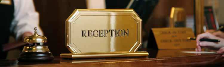 Reception sign on a counter at a resort