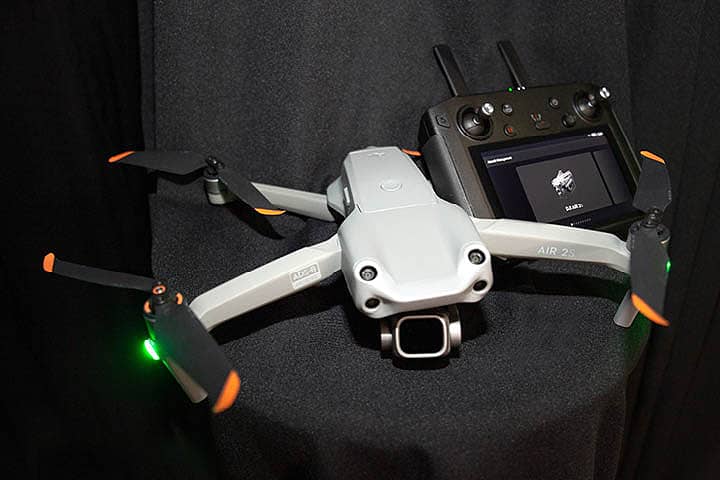DJI Air 2S Fly-More Camera Drone. HD Video, 3-Axis Gimbal with 22mm Lens. Remote Controller with a built-in screen.