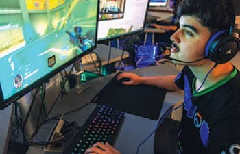 A member of the FLCC Esports team in the gaming lab.