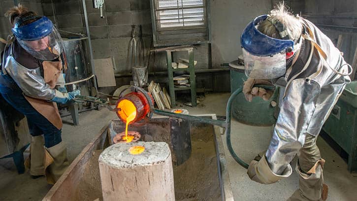 Students pouring and casting bronze in our foundry.