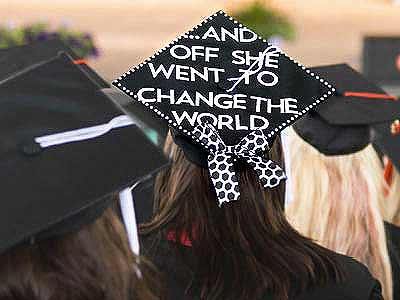 Students wearing graduate caps at a graduation ceremony